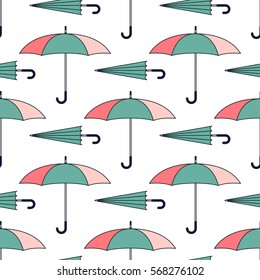 Seamless pattern with cute umbrellas. Vector illustration. Fashion background. Graphic cartoon retro texture. Vintage weather silhouette. Parasol backdrop