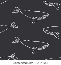 Seamless pattern with cute whales. Vector illustration.