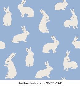 Seamless pattern with cute white rabbits. Vector illustration. 