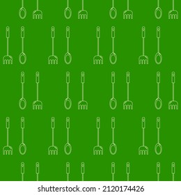 Patrón inexorable de tenedores de cubiertos y cucharas sobre un fondo verde. Para el diseño de papel pintado, embalaje, textiles.