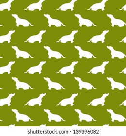 Seamless pattern with dachshund silhouettes on green background. Vector background.