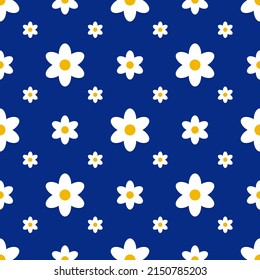 Seamless pattern with daisies on a blue background.