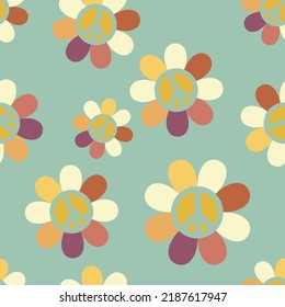 Seamless pattern with daisies and symbol of peace on green background