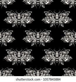 Seamless pattern. Dead head butterfly. Isolated on a black background. Great for tattoo or print on a T-shirt. Ideal for decoration of Halloween and the Day of the Dead.
