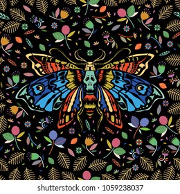 Seamless pattern. Dead head butterfly in a flower garden. Moth among flowers and leaves. Ideal for decoration of Halloween and the Day of the Dead.