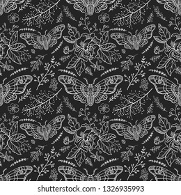 Seamless pattern. Dead head butterfly. Night garden. Moth among flowers isolated on a black background. Great for Halloween.