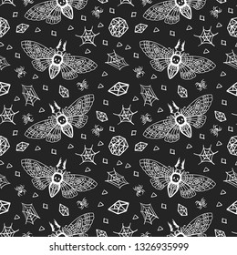 Seamless pattern. Dead head butterfly. Moth among spiders and cobwebs isolated on a black background. Great for tattoo, print on a T-shirt, for decoration of Halloween and more.