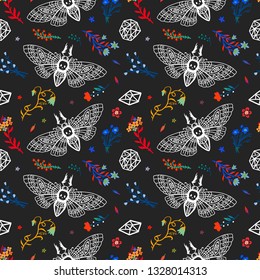 Seamless pattern. Dead head butterfly in night garden. Beautiful wildflowers. Moth among flowers and stones isolated on a black background. Great for Halloween.