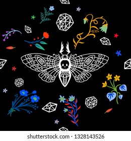 Seamless pattern. Dead head butterfly in night garden. Moth among flowers and stones isolated on a black background. For Halloween and more.