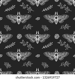 Seamless pattern. Dead head moth among the branches and stones on a black background. Hand drawn illustration. Great for tattoo, print on a T-shirt, for decoration of Halloween and more.