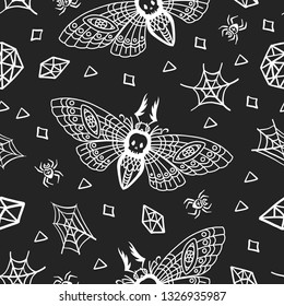 Seamless pattern. Dead head moth among spiders and cobwebs isolated on a black background. Great for tattoo, print on a T-shirt, for decoration of Halloween and more.