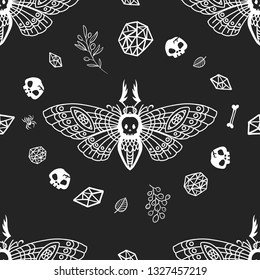 Seamless pattern. Dead head moth among witchcraft on a black background. Hand drawn illustration. Great for tattoo, print on a T-shirt, for decoration of Halloween and more.