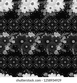 Seamless pattern. Decorated with leaves and flowers. Doodles style. for summer fabric, wrappers, covers. Easy to edit. black and white