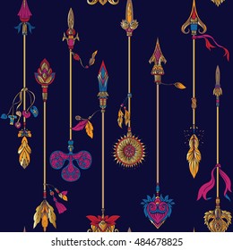 Seamless pattern with decorative arrows in classic style in gold on black background.  Vector illustration. 