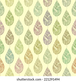 Seamless pattern with decorative autumn leaves. Colorful contour on a light yellow background.