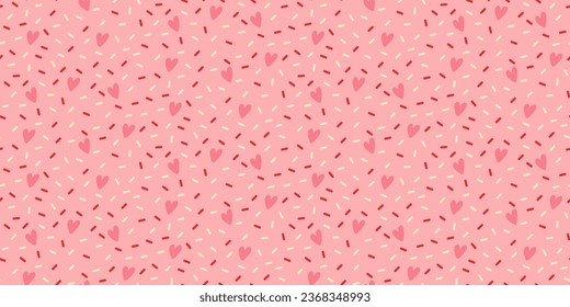 Seamless pattern with decorative bright sprinkles texture on pink background.