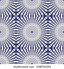 Seamless pattern with decorative circles in the style of a mandala. Vector illustration.