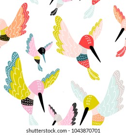 Seamless pattern with decorative colorful hummingbirds. Great for fabric, textile. Vector background