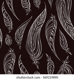 Seamless pattern from decorative feathers. Boho style background for wrapping, textile, covers, wallpapers.
