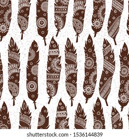 Seamless pattern with decorative feathers in ethnic style. Vector