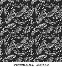 Seamless pattern with decorative feathers. Vector illustration
