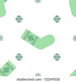 Seamless pattern with decorative green knitted Christmas sock, snowflake and Christmas tree toy