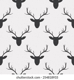 Seamless pattern with deer in black and white colors. Vector illustration.