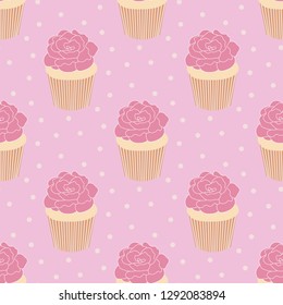 Seamless pattern of delicious cupcakes with roses on top on a cute polka dot background. Great for textile print, invitations, or packaging. Vector file.