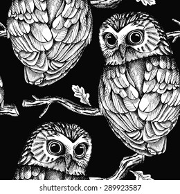 Seamless pattern depicting owls on oak branches. Vector black and white illustration.