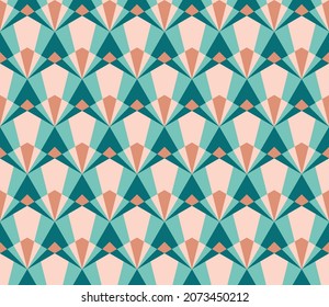 Seamless Pattern design with an art deco style in blue, coral and beige. Background with a modern hexagon geometric pattern in pastel tones