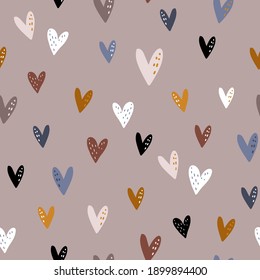 Seamless pattern design with colorful hearts in boho style. Vector romantic background. Great for fabric, textile, apparel.