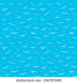 Seamless pattern design for fabric or background on which white birds seagulls are flying in the blue sky