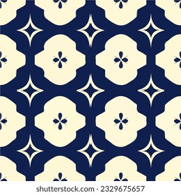 Seamless pattern design featuring a blue and white color scheme. It showcases a delicate flower motif, creating an elegant damask pattern for fabrics or wallpapers.