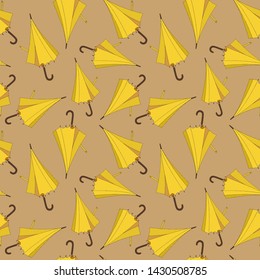 Seamless pattern design with yellow beach umbrellas on the sand
