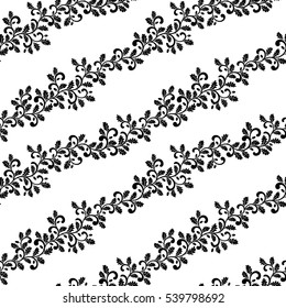 Seamless pattern. Diagonal twisted branches with oak leaves isolated on a white background