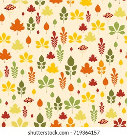 Seamless pattern with different autumn leaves in orange, green, brown and yellow. Perfect for wallpaper, gift paper, pattern fills, web page background, autumn greeting cards.
