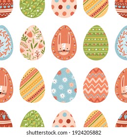 Seamless pattern with different colorful Easter eggs on white background. Repeatable spring festive texture. Endless design for printing. Hand-drawn colored flat vector illustration