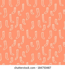 Seamless pattern with different doodle hand drawn socks isolated on light background.