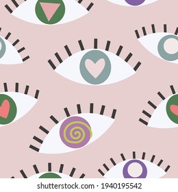 Seamless pattern with different eyes on pink background