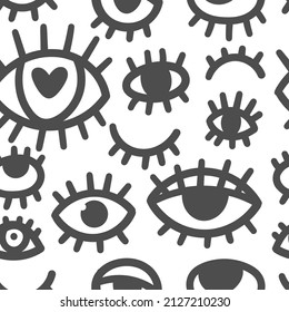 Seamless pattern with different eyes on white background. Doodle cartoon print. Line art funny wallpaper.