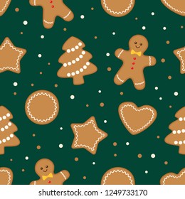 Seamless pattern with different gingerbread christmas cookies on green background. Vector illustration 