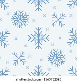 Seamless pattern with different snowflakes on a light blue background