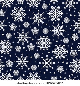 Patrón sin foco de diferentes copos de nieve en un fondo azul