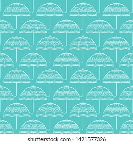 Seamless pattern with different umbrellas in white and green tones