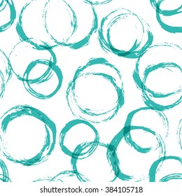 Seamless pattern with distressed dry brush circles and spots