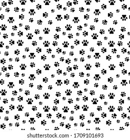 Seamless pattern with dog paw prints on light background.  Vector illustration.