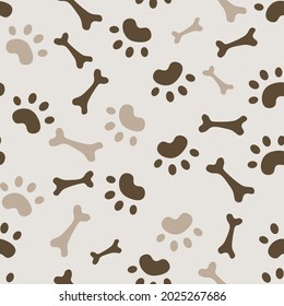 Seamless pattern with dog paws and bone. For textile fabrics. Childish pattern ornament.Beige and brown