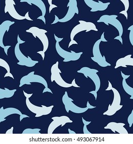 Seamless pattern with  dolphins on the dark blue background