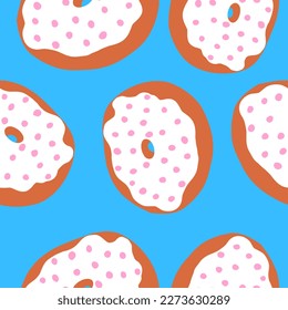 Seamless pattern of donut rings in cartoon flat style. Pink balls sprinkles on a white cream with toasted base. Sweet bakery. Vector colorful illustration isolated on blue background.