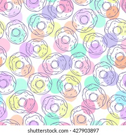 Seamless pattern with donuts on a polka dot background